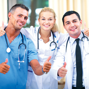 two male doctors and one female doctor giving a thumbs up for photo