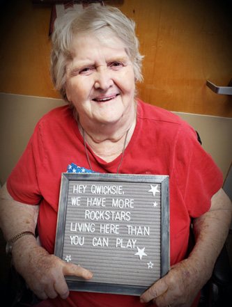 Elizabethtown resident Barbara holding a sign