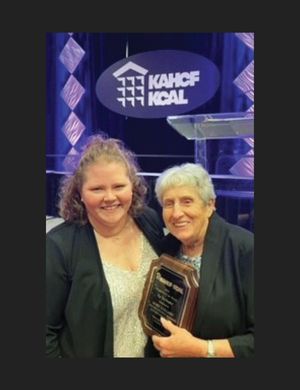 two adult women accepting a Best of Kentucky Award on behalf of Elizabethtown Nursing and Rehab