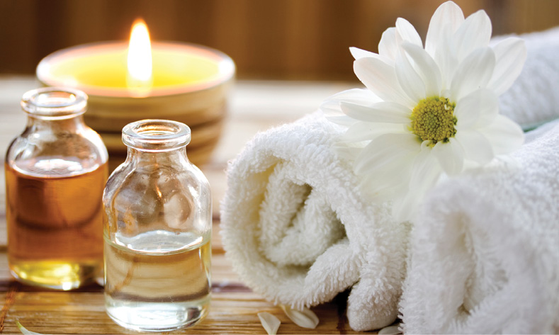 Oils, towels, florals, candles, spa, relaxing atmosphere