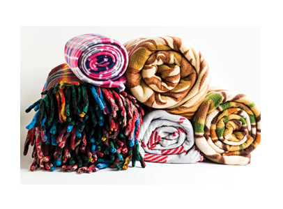 stack of rolled fleece blankets